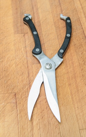 scissors for cutting fish on boardの写真素材