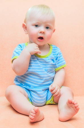 a small child looking surprisedの写真素材