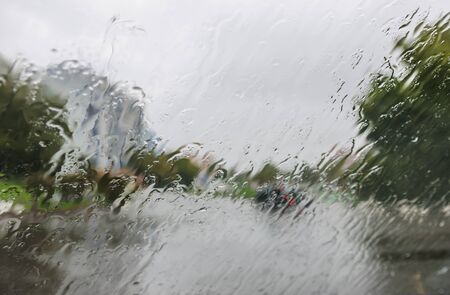rain drops on glass with a backgroundの写真素材