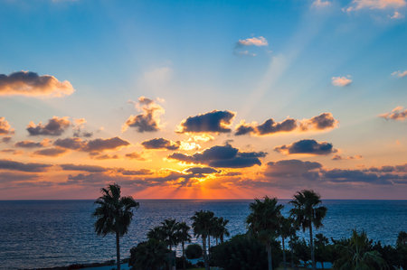 colorful and orange sunset over the seaの写真素材