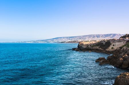 beautiful sea landscape of the island of Cyprus with a rocky shoreの写真素材
