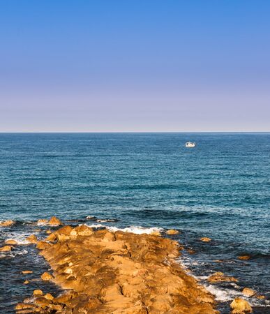 beautiful sea landscape of the island of Cyprus with a rocky shoreの写真素材