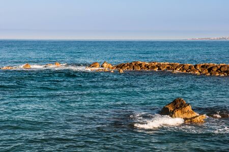 beautiful sea landscape of the island of Cyprus with a rocky shoreの写真素材