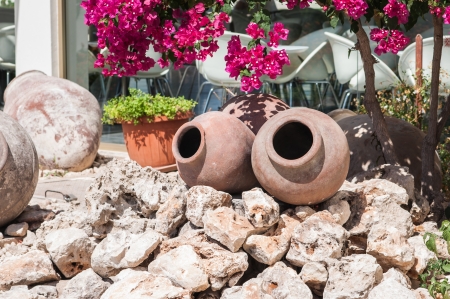 old pottery crock as decoration is on the groundの写真素材