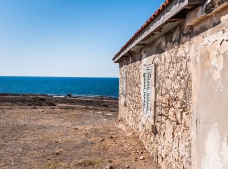 old house with red roof on the beachのeditorial素材