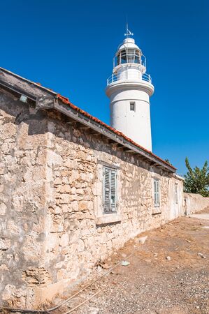 white lighthouse and the old house on the island of Cyprusのeditorial素材