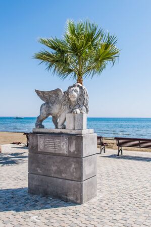 lion statue with wings on background of the sea island of Cyprusの写真素材