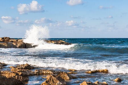 waves on the sea landscape on a background of blue sky with cloudsの写真素材