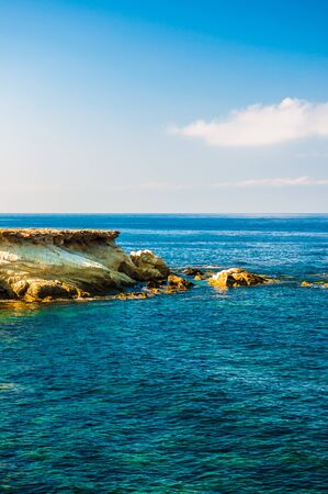 beautiful sea landscape of the island of Cyprus with a rocky shoreの写真素材