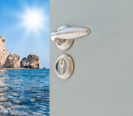 exposed metallic gray door with a sea viewの写真素材