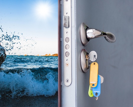 exposed metallic gray door with a sea viewの写真素材