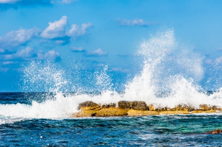 waves on the sea landscape on a background of blue sky with cloudsの写真素材