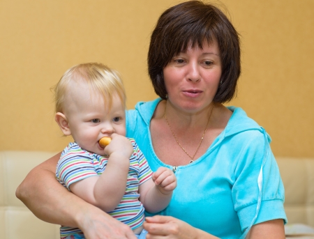 baby and grandma with her mouth openの写真素材