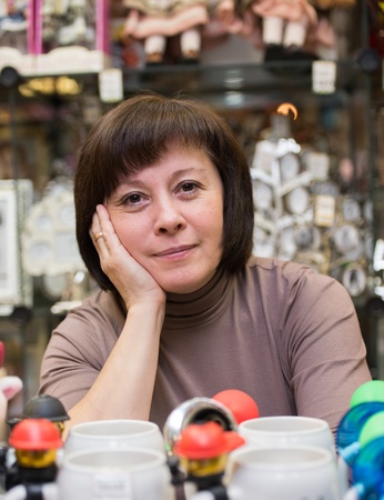 middle-aged woman in the gift shop sellerの写真素材