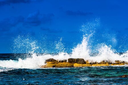 waves on the sea landscape on a background of blue sky with cloudsの写真素材