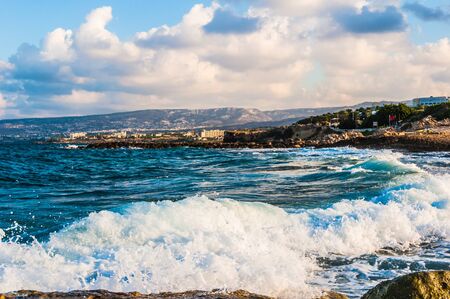 waves on the sea landscape on a background of blue sky with cloudsの写真素材