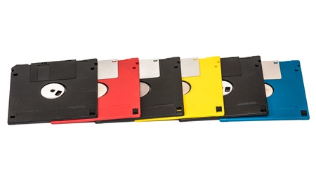 old obsolete colored floppy disks on a white backgroundの写真素材
