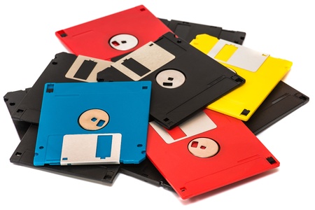 old obsolete colored floppy disks on a white backgroundの写真素材
