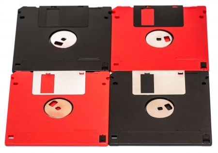 old obsolete colored floppy disks on a white backgroundの写真素材
