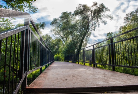 passage into the park through the old bridgeの写真素材