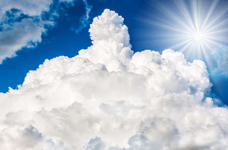 sun with clouds against the blue skyの写真素材
