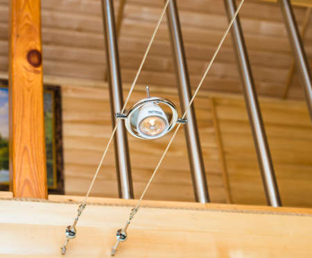 contemporary original lamp hanging on the ropes in the style of hi-techの写真素材