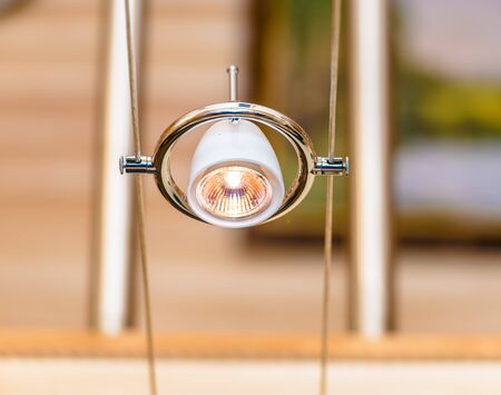 contemporary original lamp hanging on the ropes in the style of hi-techの写真素材