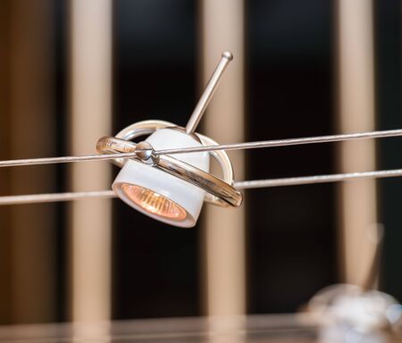 contemporary original lamp hanging on the ropes in the style of hi-techの写真素材