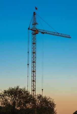 Lift crane building a new residential buildingの写真素材