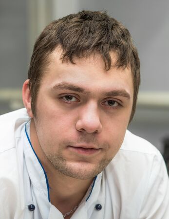 portrait of a young man in chefの写真素材