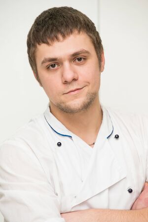 portrait of a young man in chefの写真素材