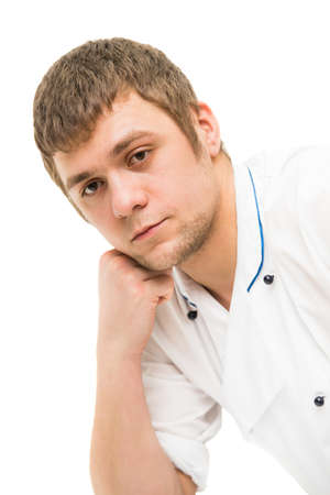 the young man thought his head in his handの写真素材