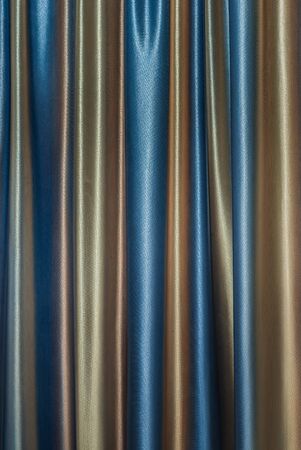 dense textile curtain background with foldsの写真素材