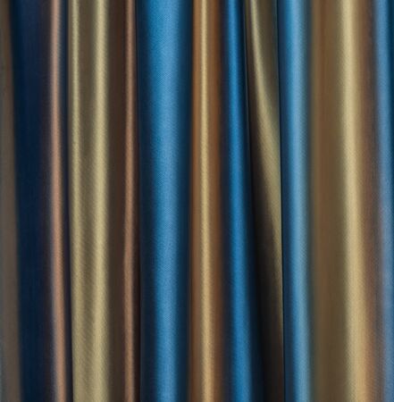 dense textile curtain background with foldsの写真素材