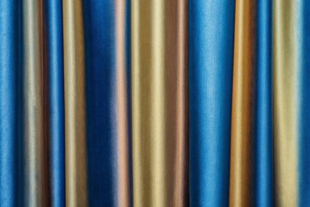 dense textile curtain background with foldsの写真素材