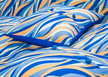 small colored pillows for the sofa with a button abstract formの写真素材