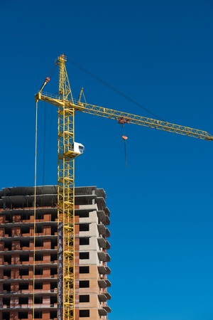 Building of the new high house by the craneの写真素材