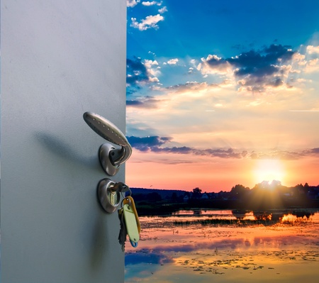 open door facing the oblechnoe sky with sunset in the lakeの写真素材