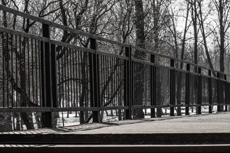 passage into the park through the old bridgeの写真素材
