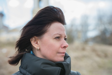 portrait of a middle-aged brunette in a black jacket fallの写真素材