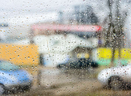 rain drops on glass with a backgroundの写真素材