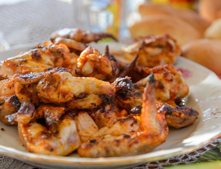 appetizing pieces of fried chicken on a white plateの写真素材