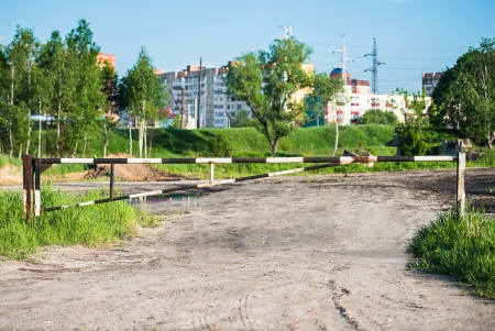 barrier in a field on the lock with a chainの写真素材