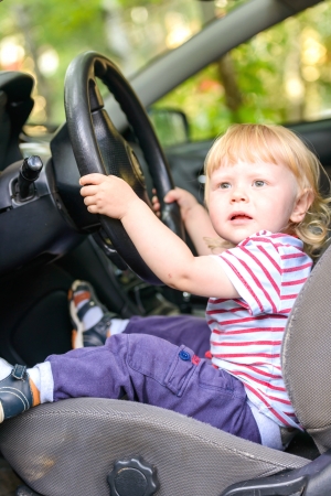 boy child sitting on the driverの写真素材