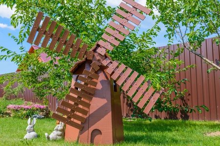 the layout of the old wooden mill in the garden is not the lawnの写真素材