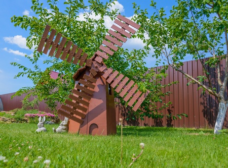the layout of the old wooden mill in the garden is not the lawnの写真素材