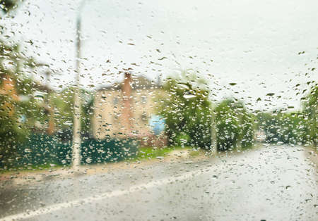 rain drops on glass with a backgroundの写真素材
