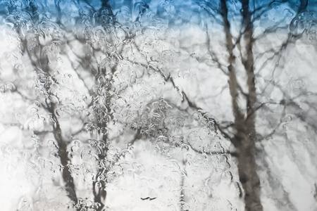rain drops on glass with a backgroundの写真素材