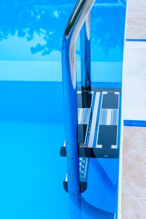 ladder into the pool of blue color without waterの写真素材
