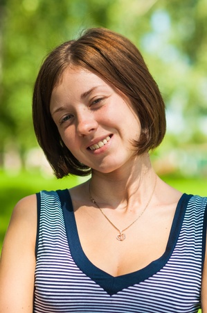 Portrait of a young girl in a striped T-shirtの写真素材